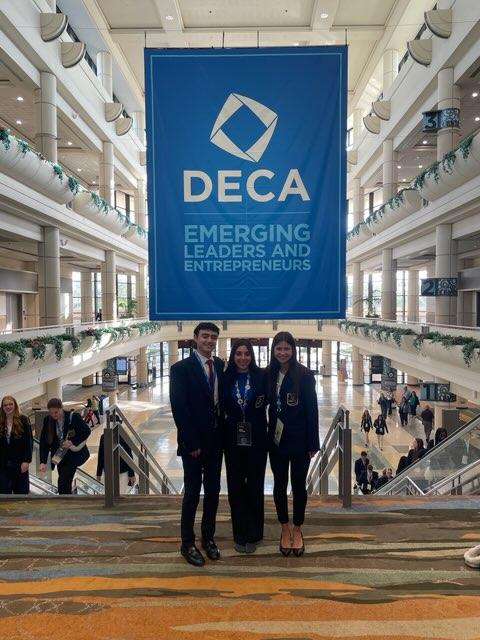 Seniors Maddox Walker, Ava Edwards, and Isabel Cherrito pose at the International Career Development Conference, also known as DECA nationals, held in Orlando, Florida.