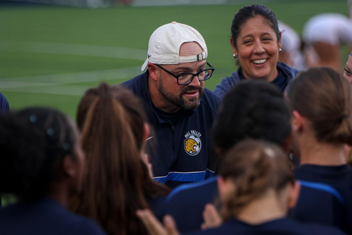 Speaking with the team, Head Coach Justin Crawford congratulates the team on making it to state.