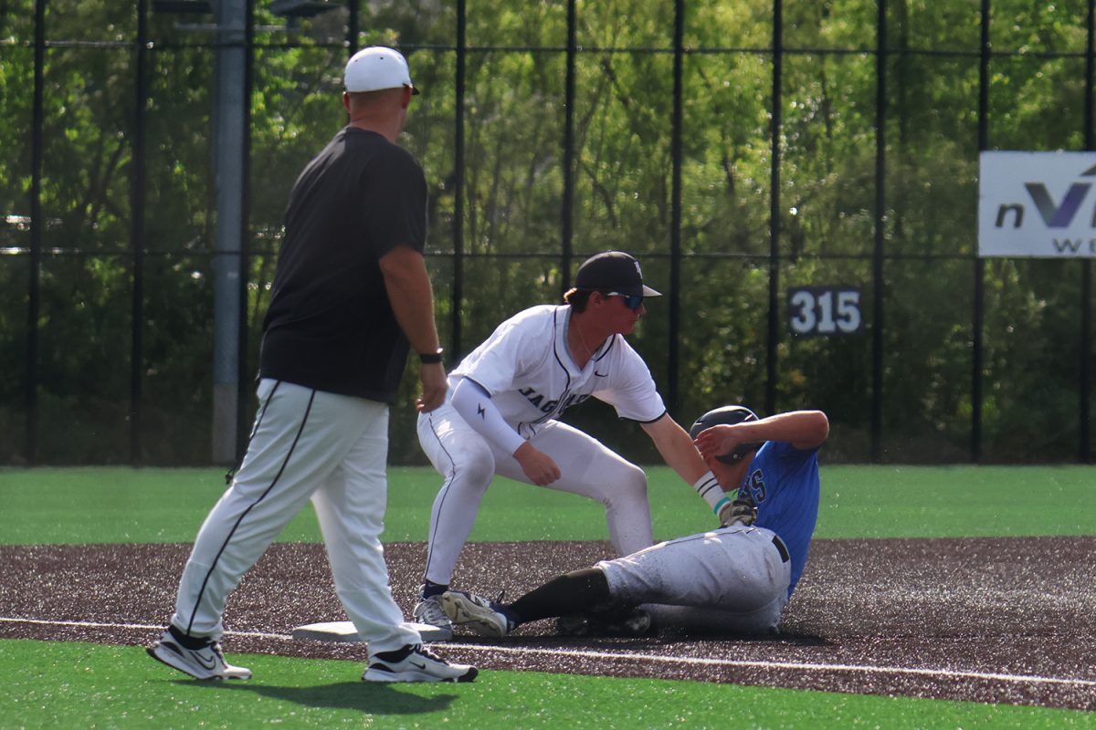 Glove down, junior Drew Yockey tags the kid out at third in the first game of regionals.