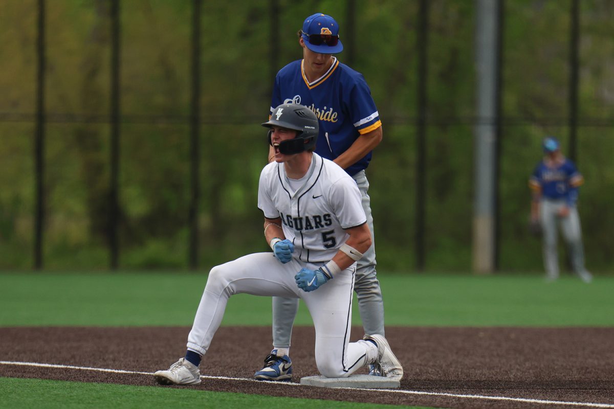 Yelling in excitment, senior Connor Bohon celebrates his triple.