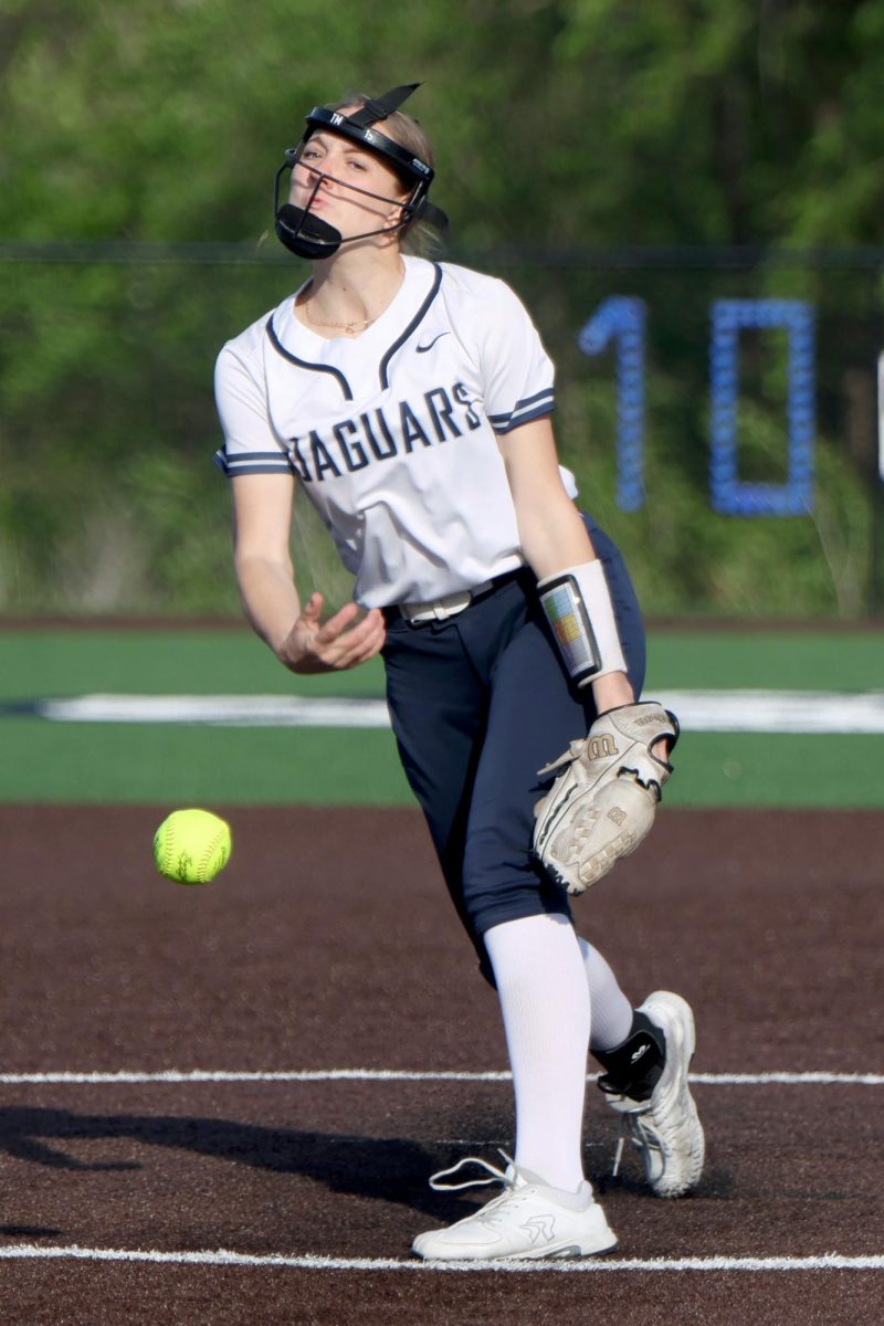Releasing the ball, sophomore Teagan Middleton pitches a strike. 
