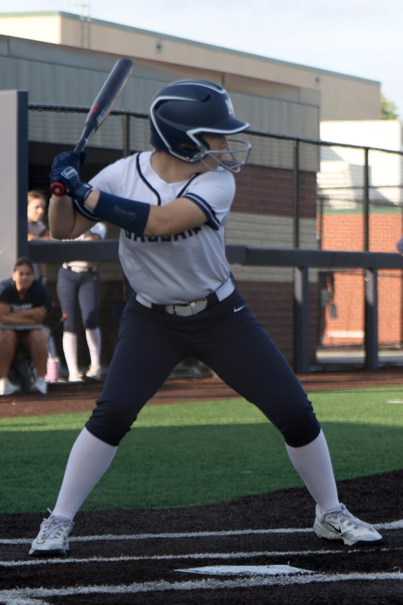  Bat in hands, senior Molly Griffin waits for the pitch. 
