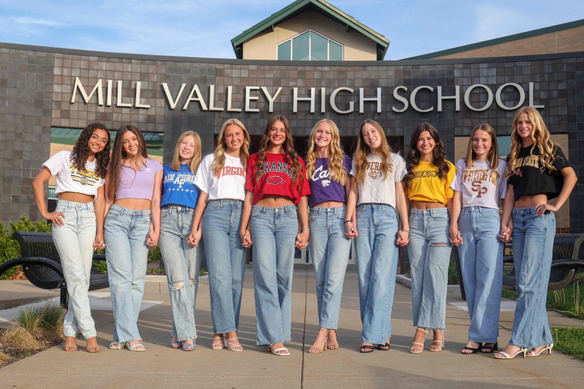 Seniors Alonnah Gage, Brooklyn Markovich, Laura Hickman, Maggie Wieland, Seville Skinner, Charlotte Caldwell, Callie Cahoy, Isabel 
Cherrito, Meg McAfee, and Calista Marx stand in front of Mill Valley to get senior photos taken together.  