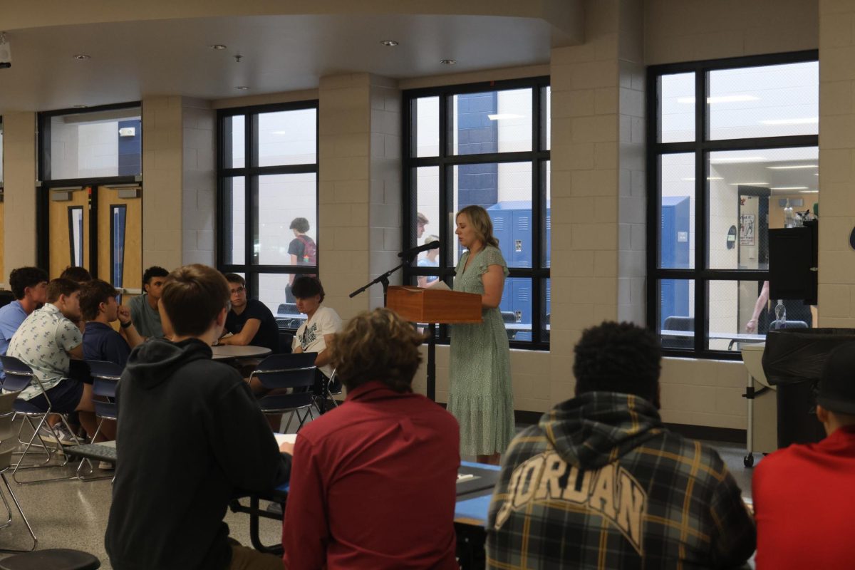 After being voted by the senior class to speak, English teacher Page Anderson gives a speech.