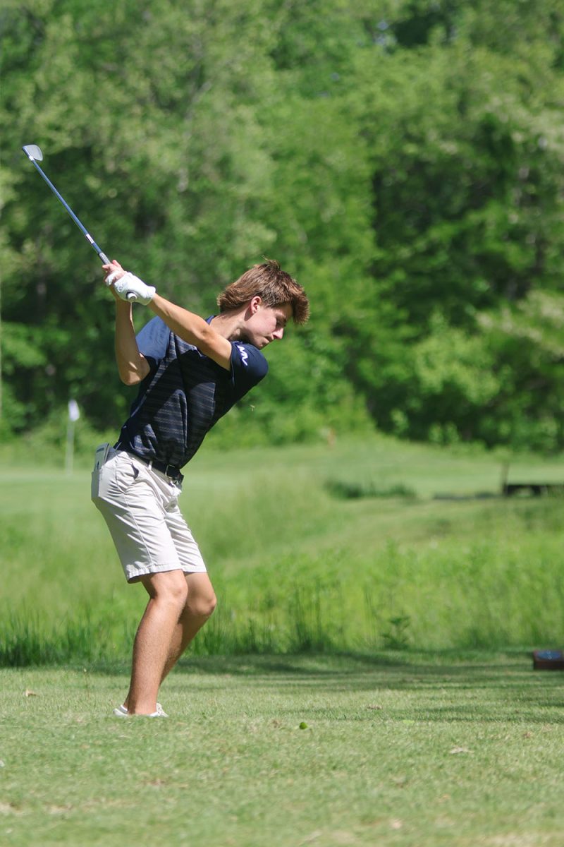 Staying focused, junior Brayden Repp prepares to hit the ball. 
