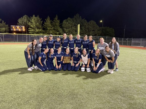 The softball team celebrates their first regional title since 2019 after defeating Olathe Northwest Thursday, May 22.