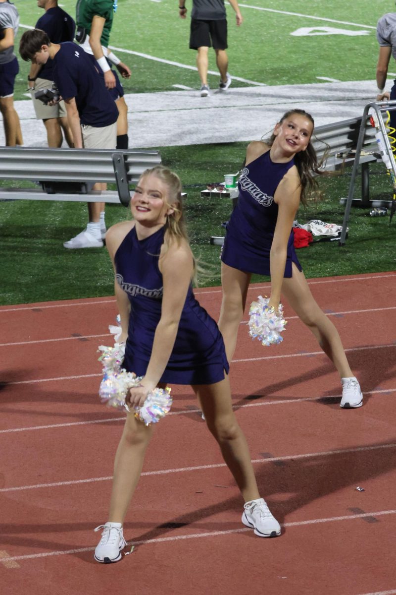 Freshman Lauren ___ and Senior Sydney Lenon dance to the Silver Stars' sideline routine in sync with the cheerleaders' cheer, Thursday, Aug. 28. 