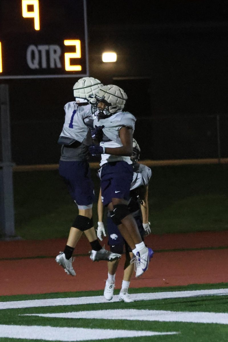 Members of the silver football team cheer and celebrate their touchdown in the middle of the game, Thursday, Aug. 28.