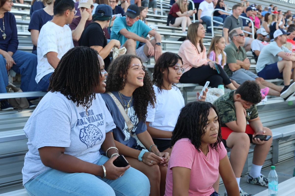 Watching excitedly, freshman Anaya Coleman, Ayira Otieno, Ahmya Couch and Jackie Lopez enjoy their first Thursday Night Lights. 