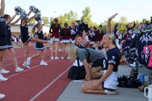 Senior Bella McPeake helps the Junior Jag cheerleaders practice their cheer routine, Thursday Aug. 28. 