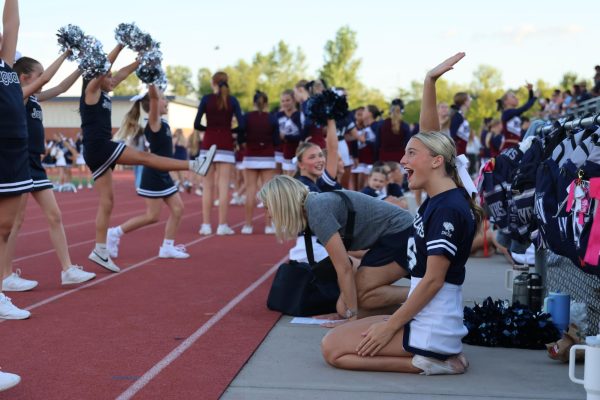 Senior Bella McPeake helps the Junior Jag cheerleaders practice their cheer routine, Thursday Aug. 28. 