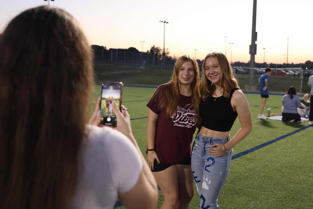 With the sunrise in the background, seniors  Taylor Goodwin and Ashlyn Keim capture their friendship with a photo
