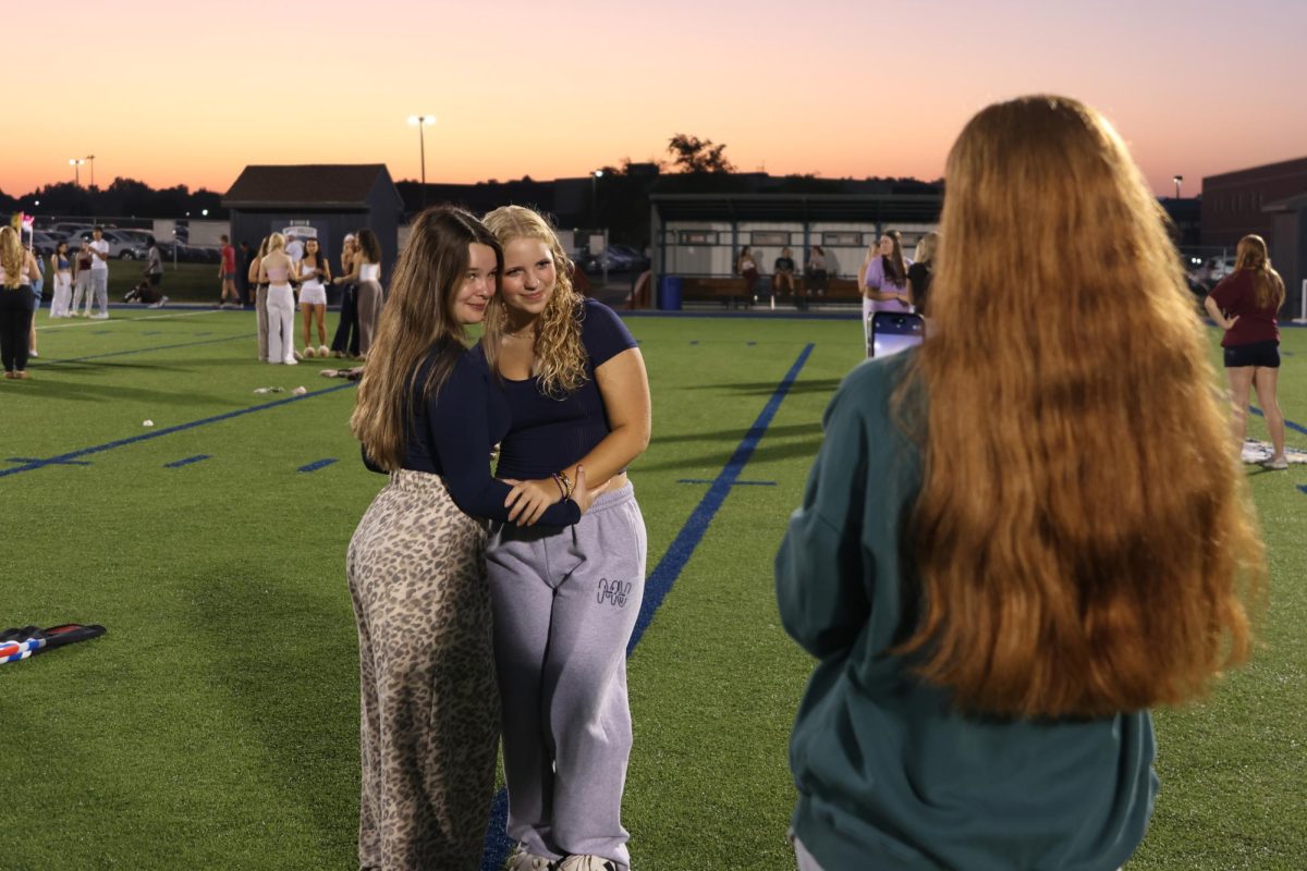 Saving a special bond, seniors Abby Haney and BIanca Pepe form a memory for senior sunrise, Aug, 20.
