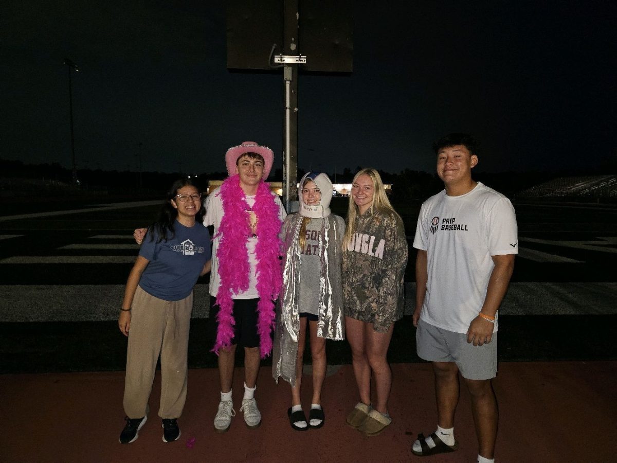 StuCo members junior Natalia Castillejos-Ramirez, freshmen Colby Holick and Anna Stanion, and juniors Avery Huber and Josh Garcia stood on the field shortly after picking up the freshmen from their houses.