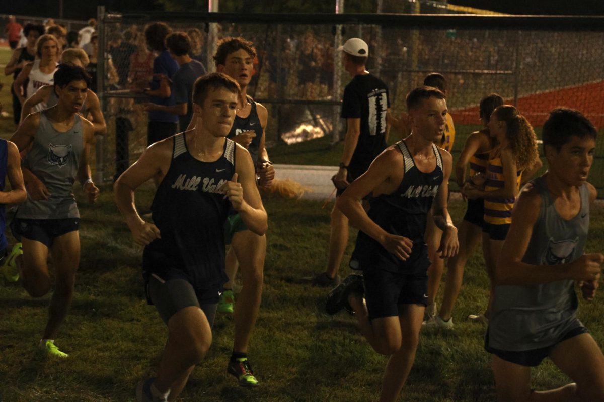 Running together, junior Carson Schmidtlein and sophomore Arthur Kaemmer focus on what's ahead.
