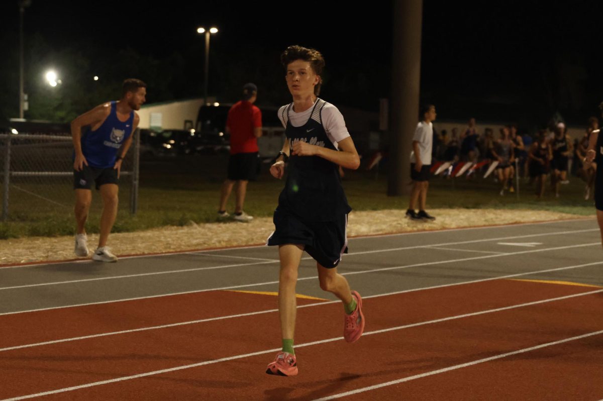 Maintaining speed, freshman Asher Yager sets a pace for himself.
