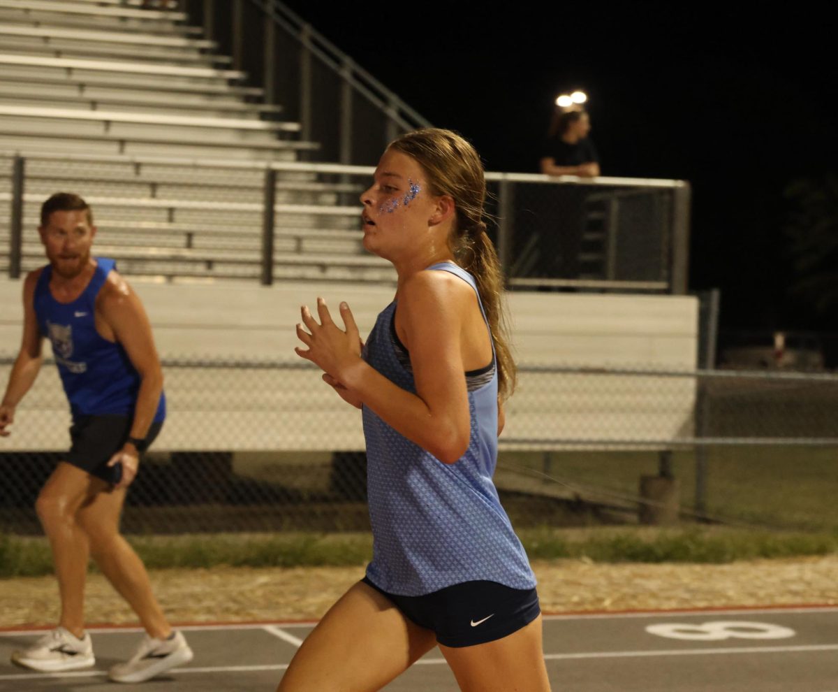 Looking ahead, sophomore Anna Schmidtmann runs strong.