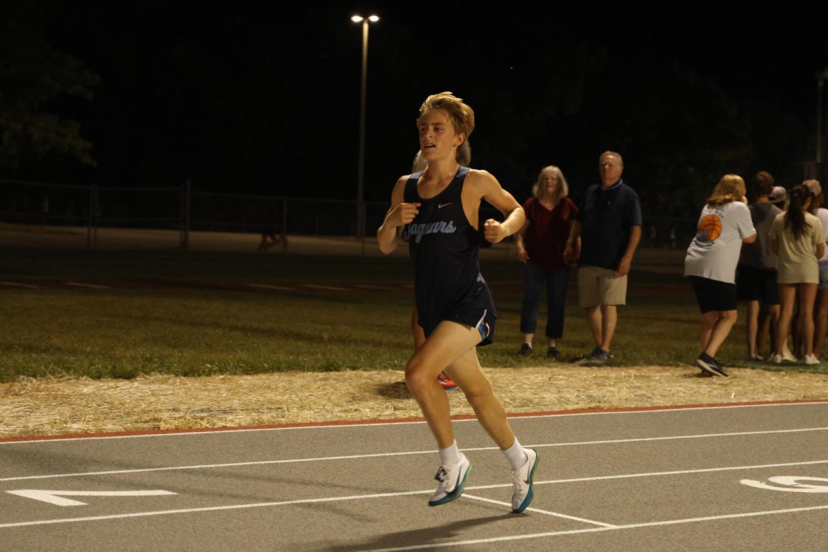 Pacing himself, senior Dillon Schmidtmann pushes himself to the finish.