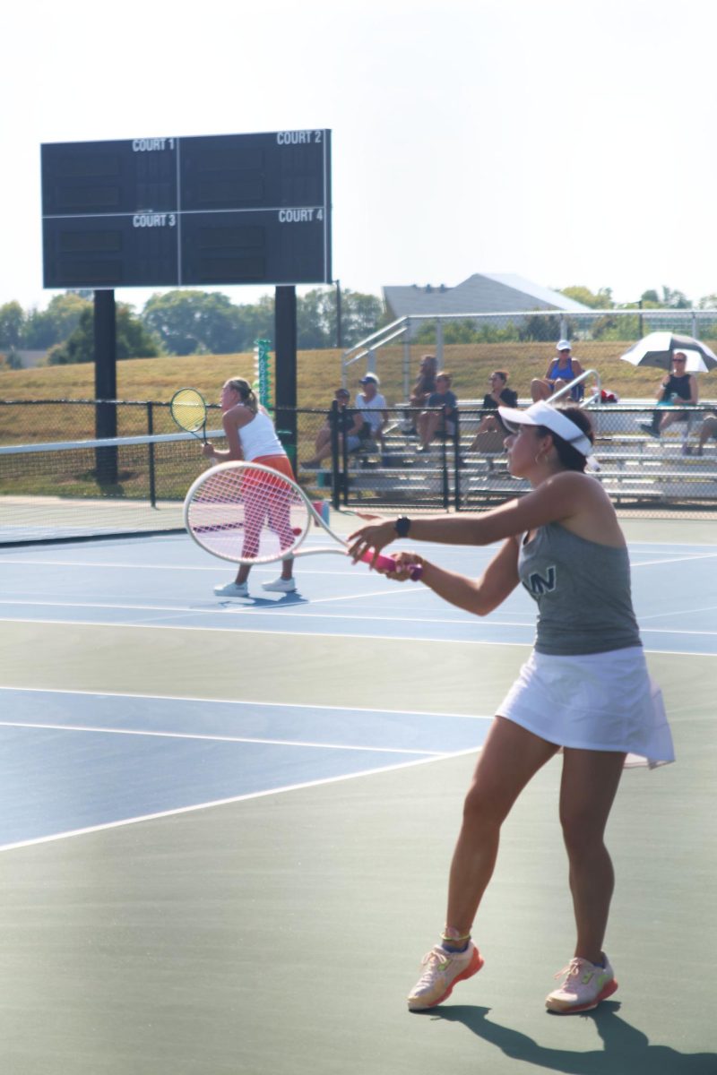 Senior Ava Edwards rallies the ball back and forth with her opponent. 