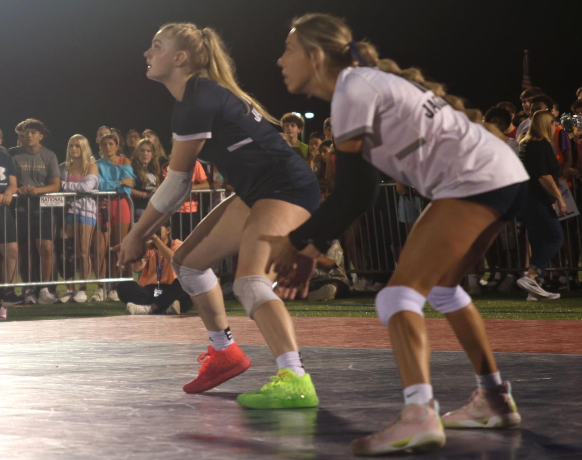Junior Riley Riggs and Senior Corrine Schwindt prepare for the next ball sent over the net by the Piper Pirates.
