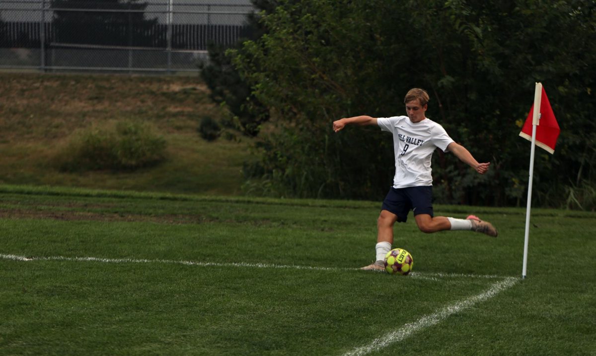 Sophomore Austin Brown takes a corner kick during the game 