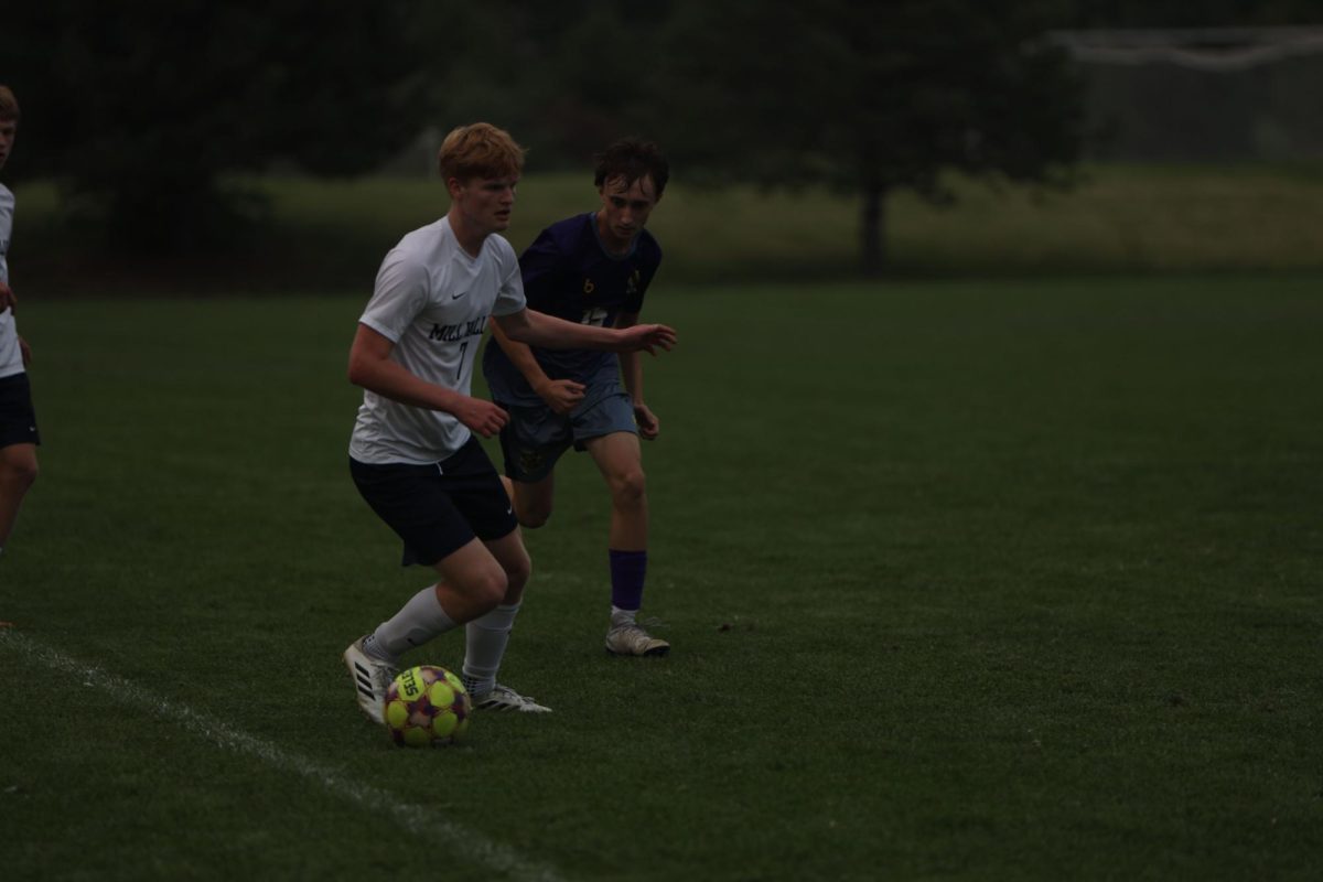 Senior Caleb Hayes is able to keep the ball away from his opponent, Thursday Sept. 4. 