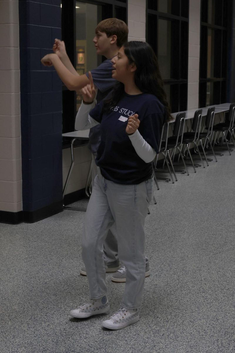 Freshman Colby Hollick and junior Natalia Castillejos-Ramirez direct students to get their lunch at the Regional Student Council Conference on Monday, Sept. 22.