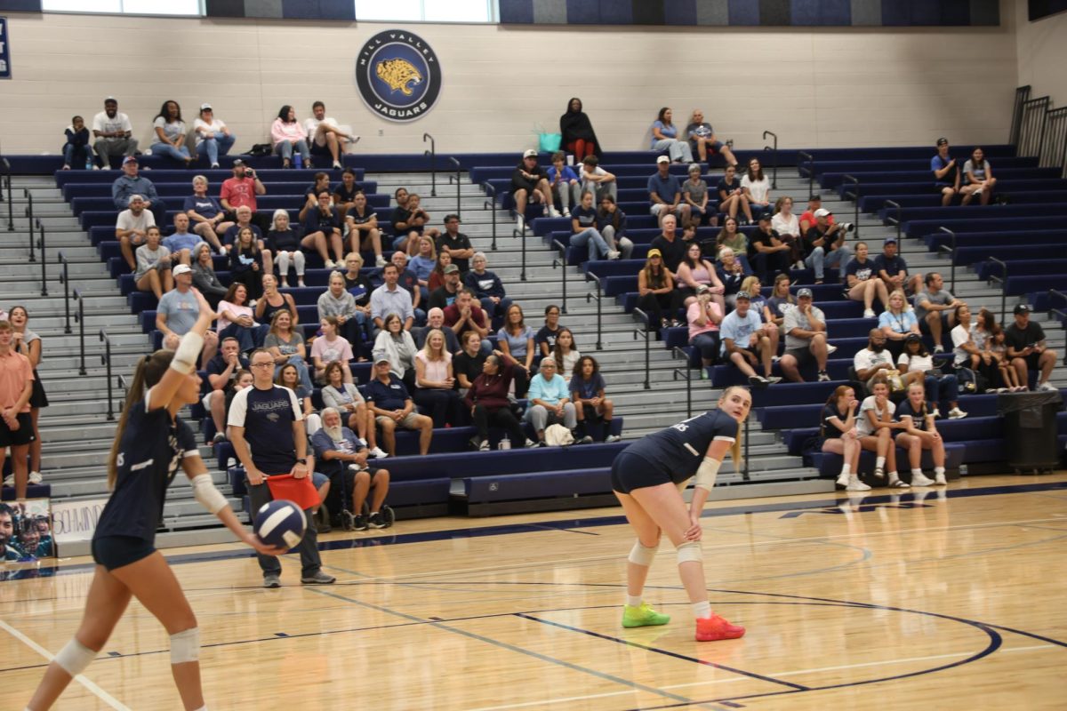 Senior Ella Florez starts the point off with a powerful serve