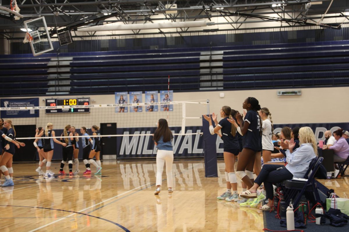 The varsity sideline erupts after a huge play