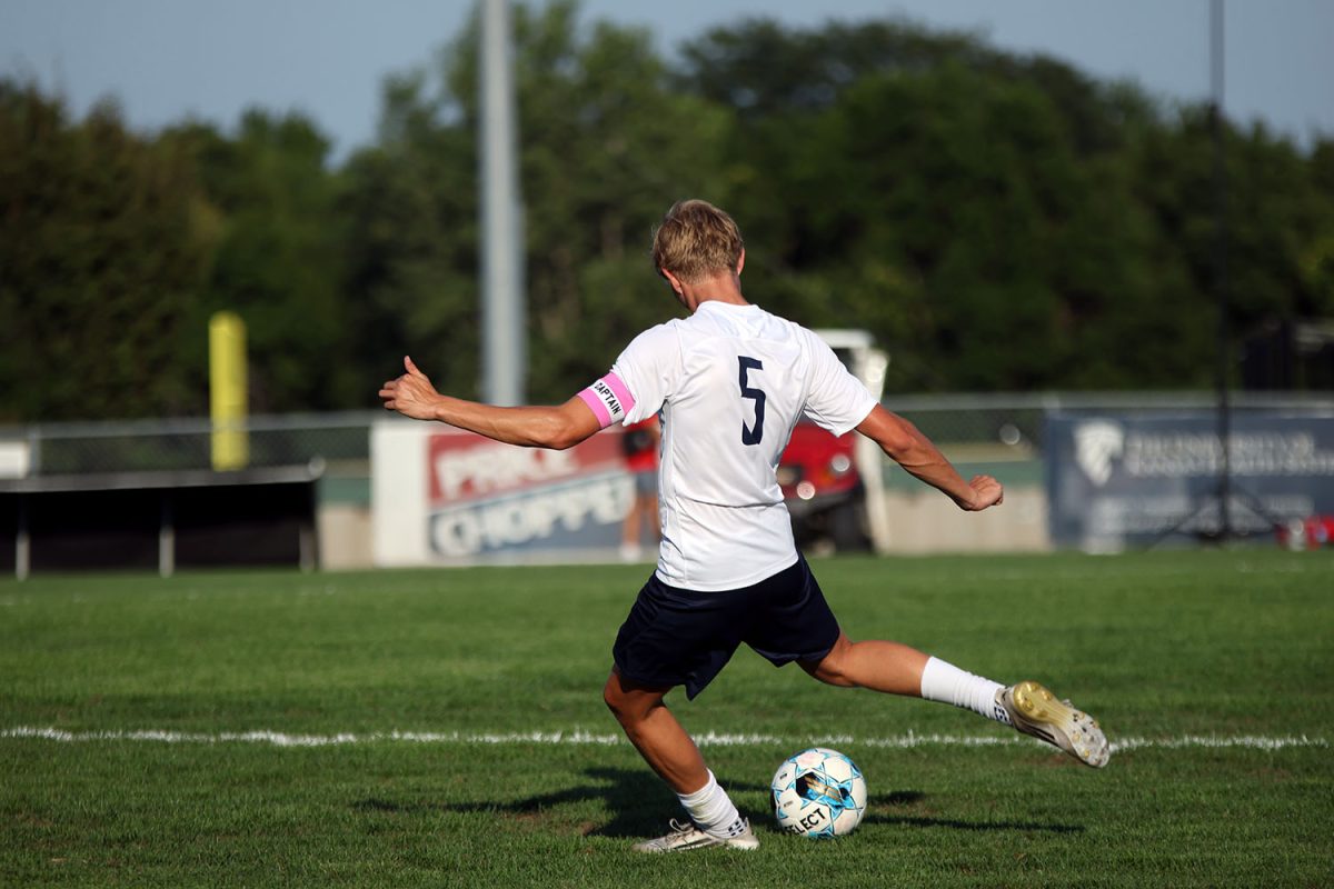 Senior Ayden Kostus winds up to kick the ball down field. Tuesday Sept. 2.