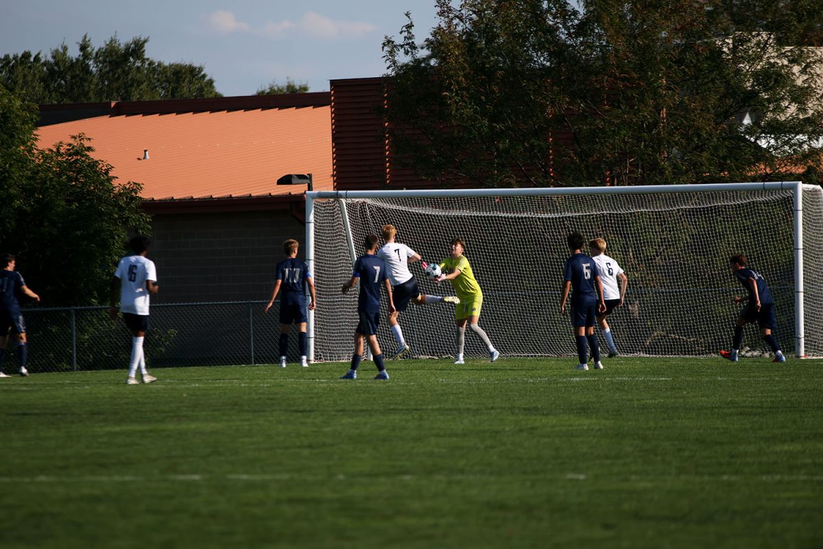 Attempting to score a goal on St. James, senior Caleb Hayes jumps to kick the ball. Tuesday Sept. 2.