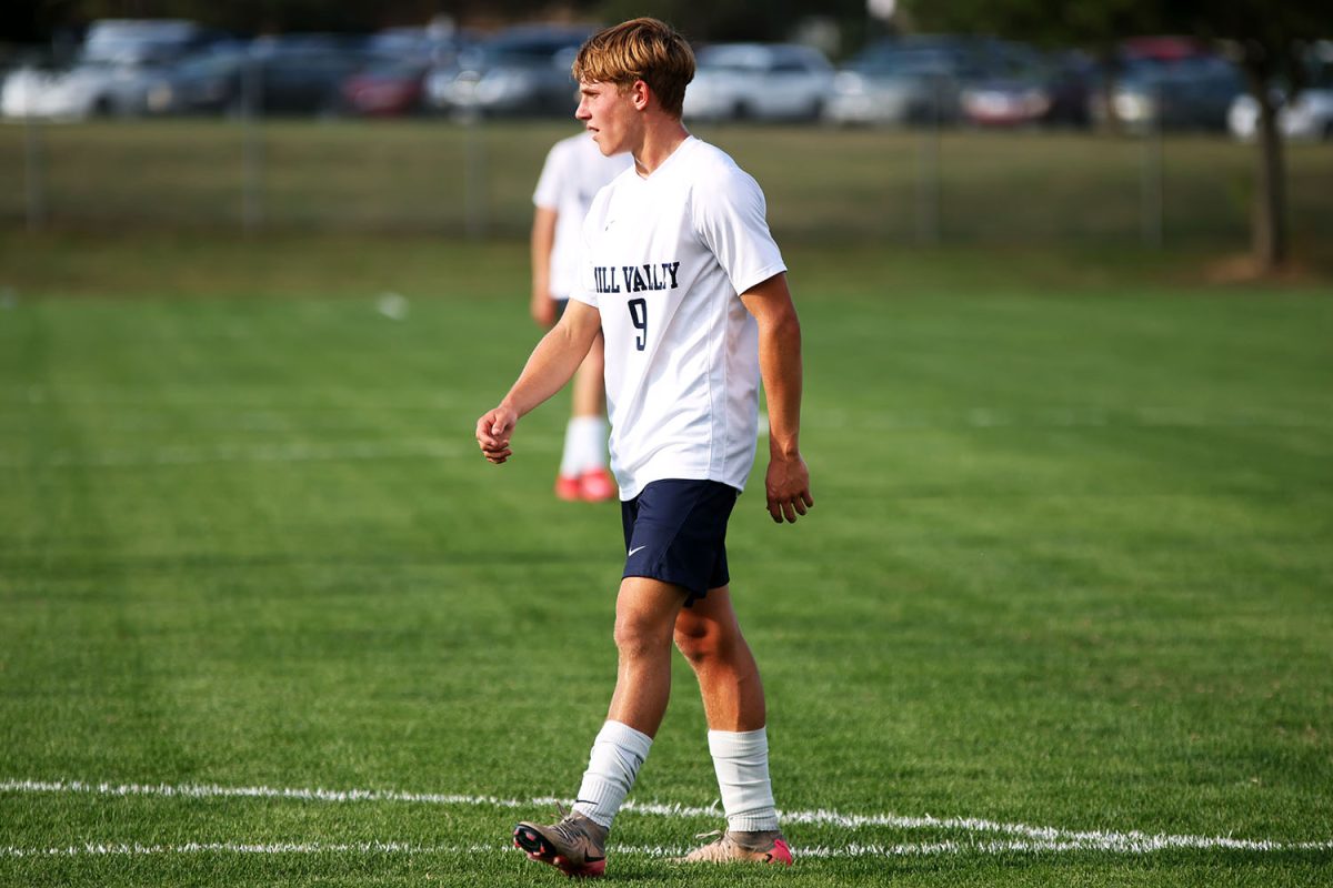 Waiting for the next play to happen, sophomore Austin Brown steps up to mid field. Tuesday Sept. 2.