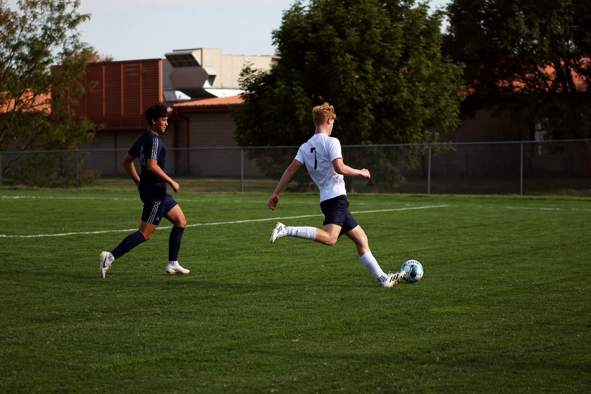Senior Caleb Hayes tries to redirect the ball towards the goal. Tuesday Sept. 2.