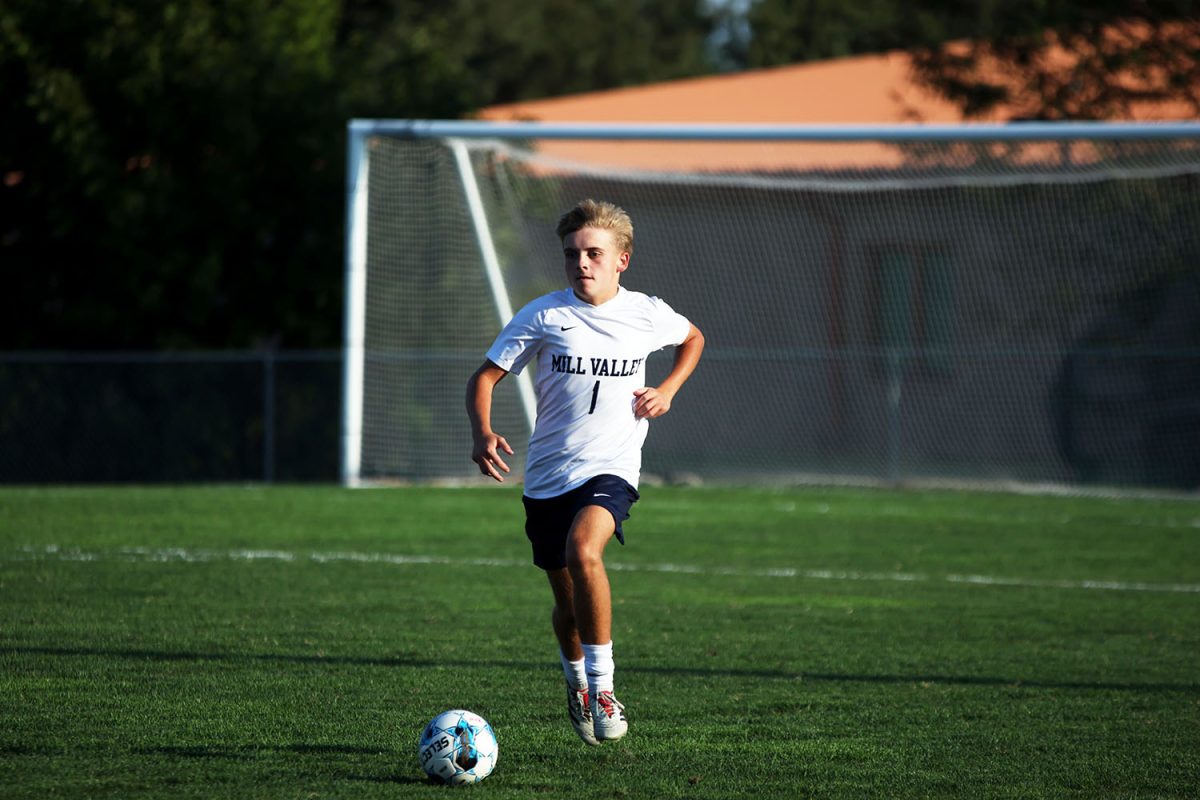 Junior Caden Coup runs to return the ball back to the other half of the field. Tuesday Sept. 2.