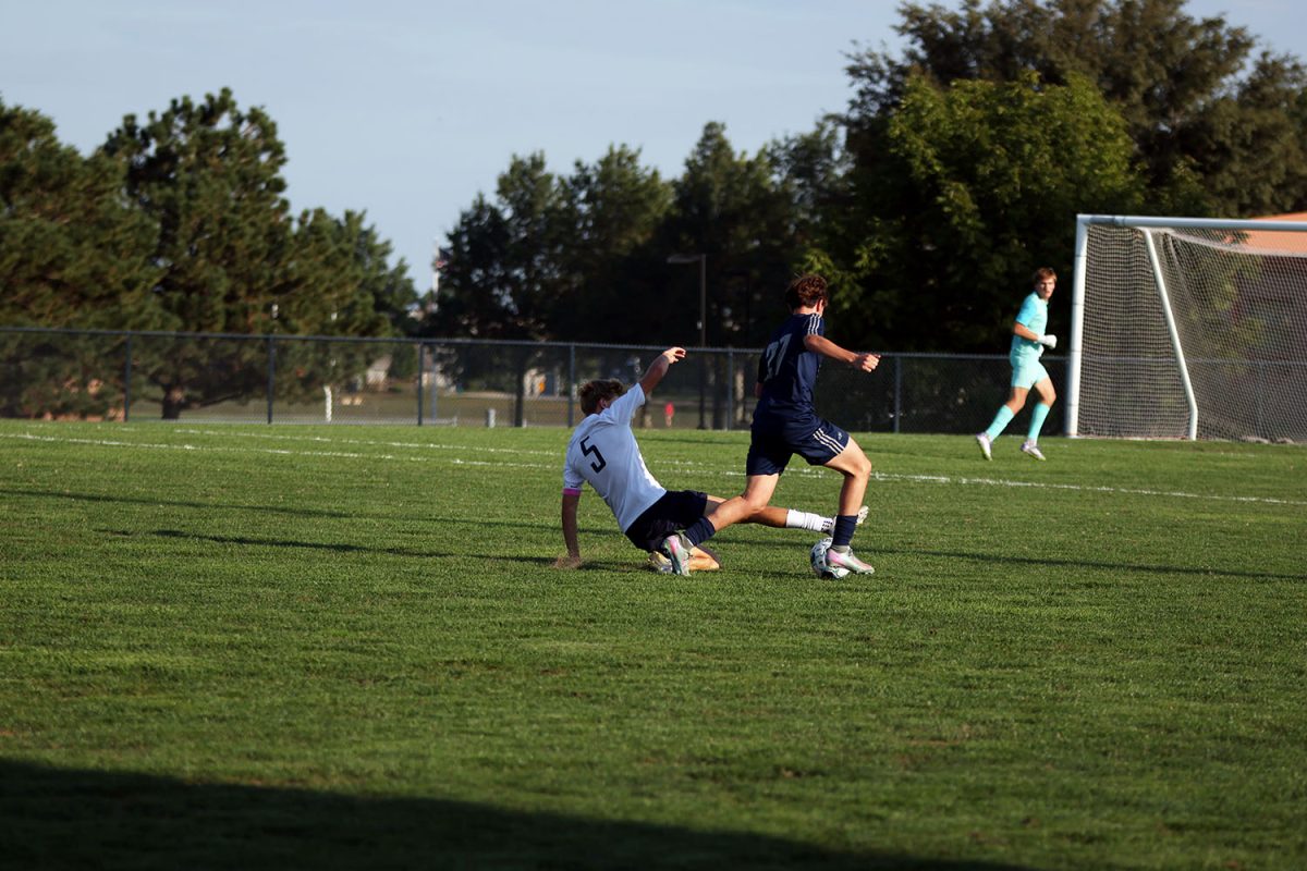 Senior Ayden Kostus slide tackles to try to take back the ball from a St. James player. 
Tuesday Sept. 2.