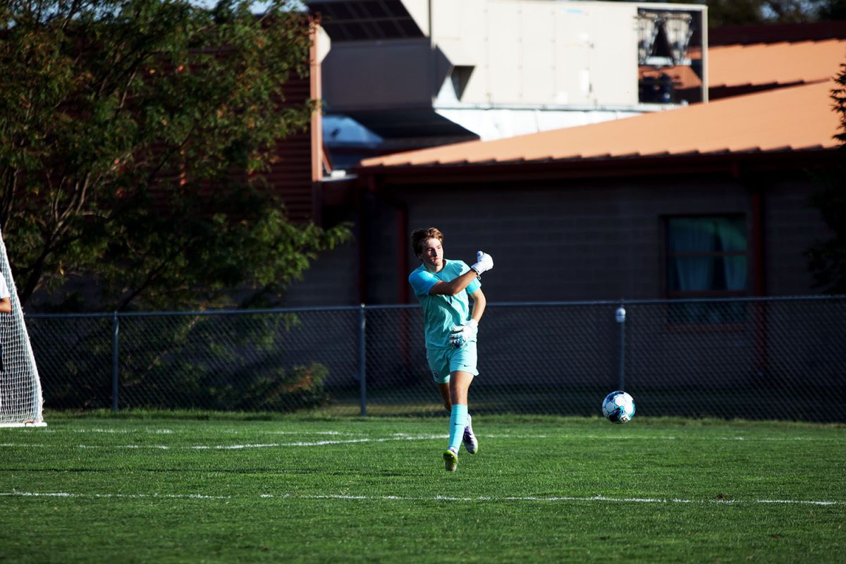 Goal keeper junior Zane Hodson rolls ball back out of goal box after receiving it. Tuesday Sept. 2.