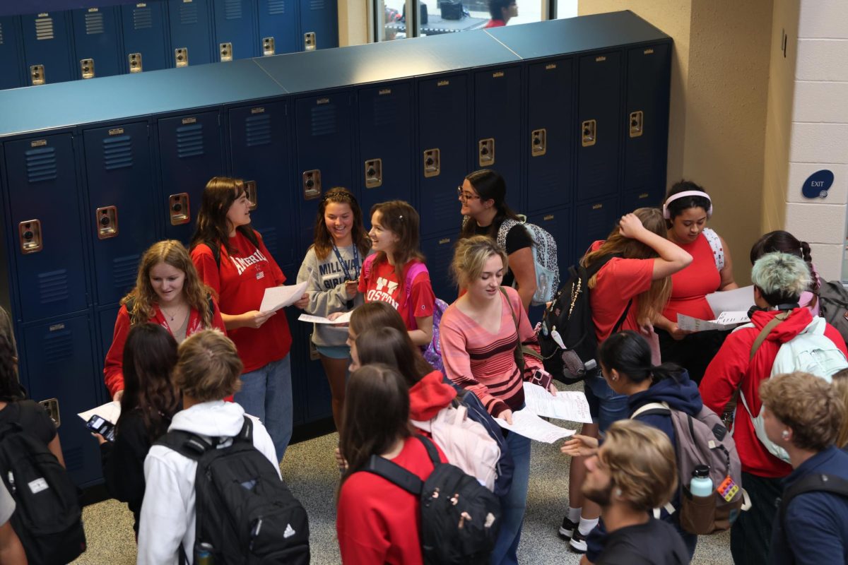 Protesting during passing period, students pass out fliers about school not keeping kids safe from gun violence on Friday, Sep. 5.