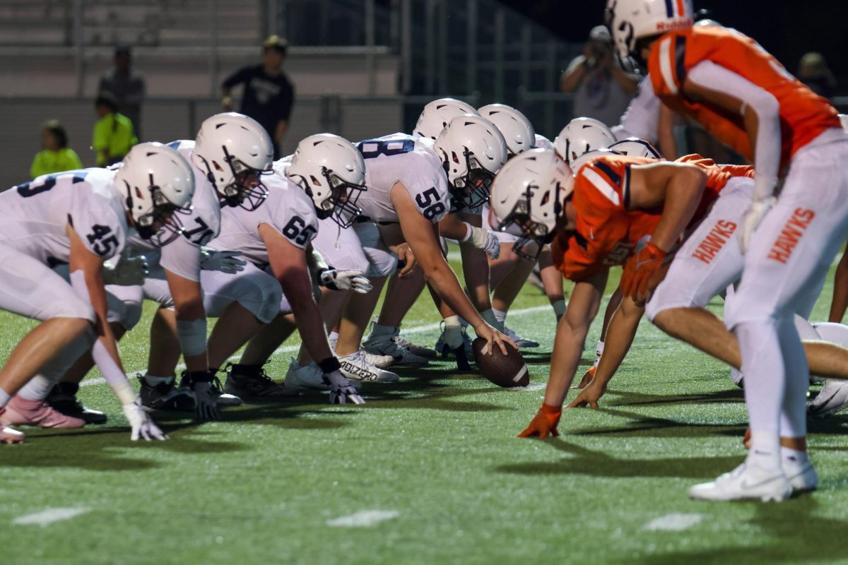 Waiting for the play to start, the offense lines up. 