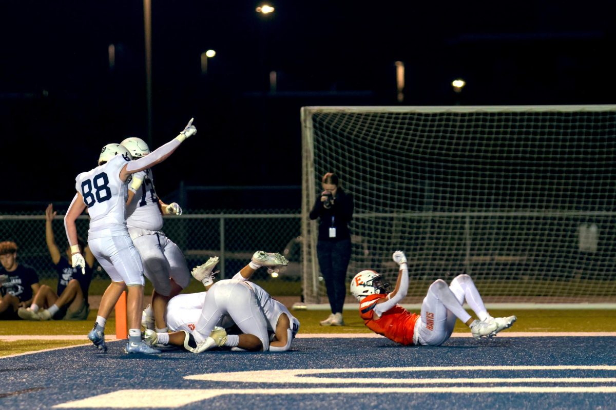 Senior Nick Philhour and junior Stone Zambo celebrate a close call touchdown 