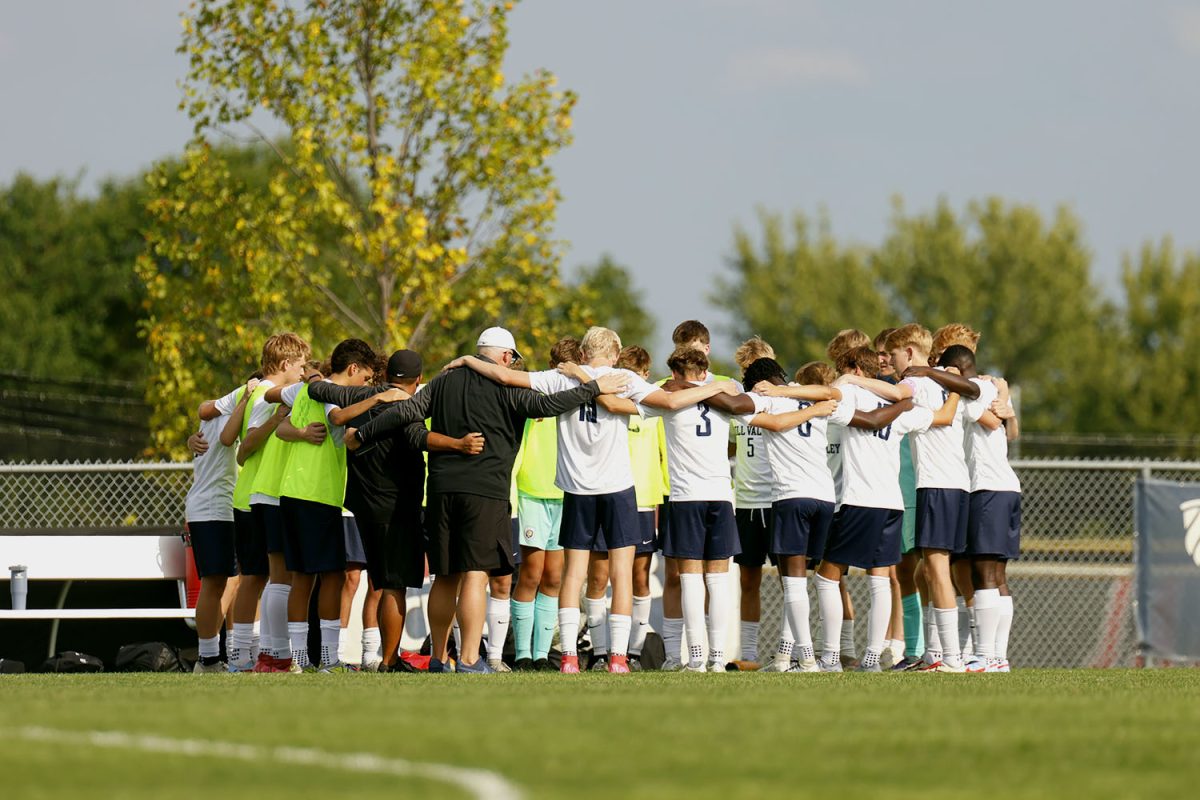 Coach Crawford and Coach Olivas helps the boys varsity team get ready to go up against St James. Tuesday Sept. 2.