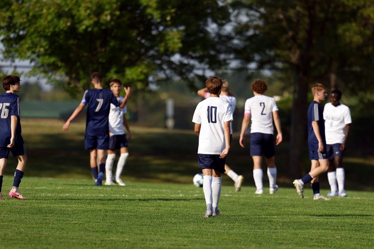 Senior Graham Kruger and senior Landon Vincent walk off the field for subbing. Tuesday Sept. 2.