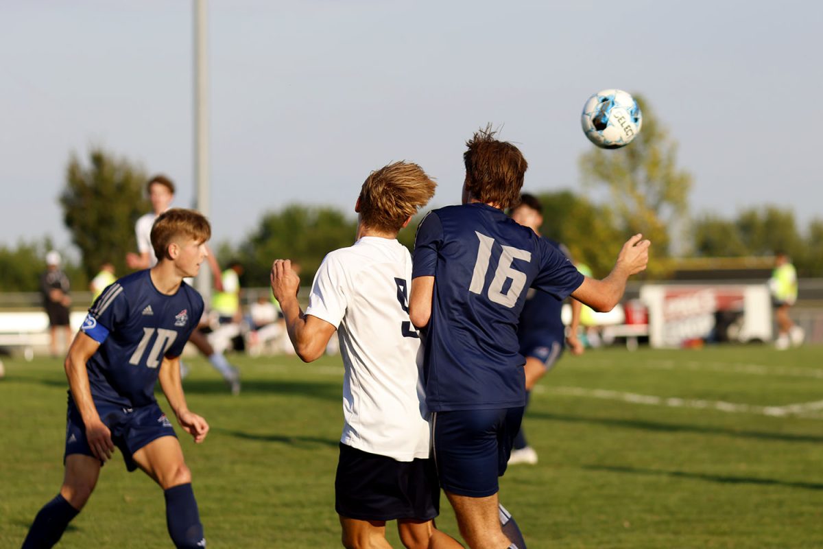 Sophomore Austin Brown hits the ball out of the way to stop the run. Tuesday Sept. 2.