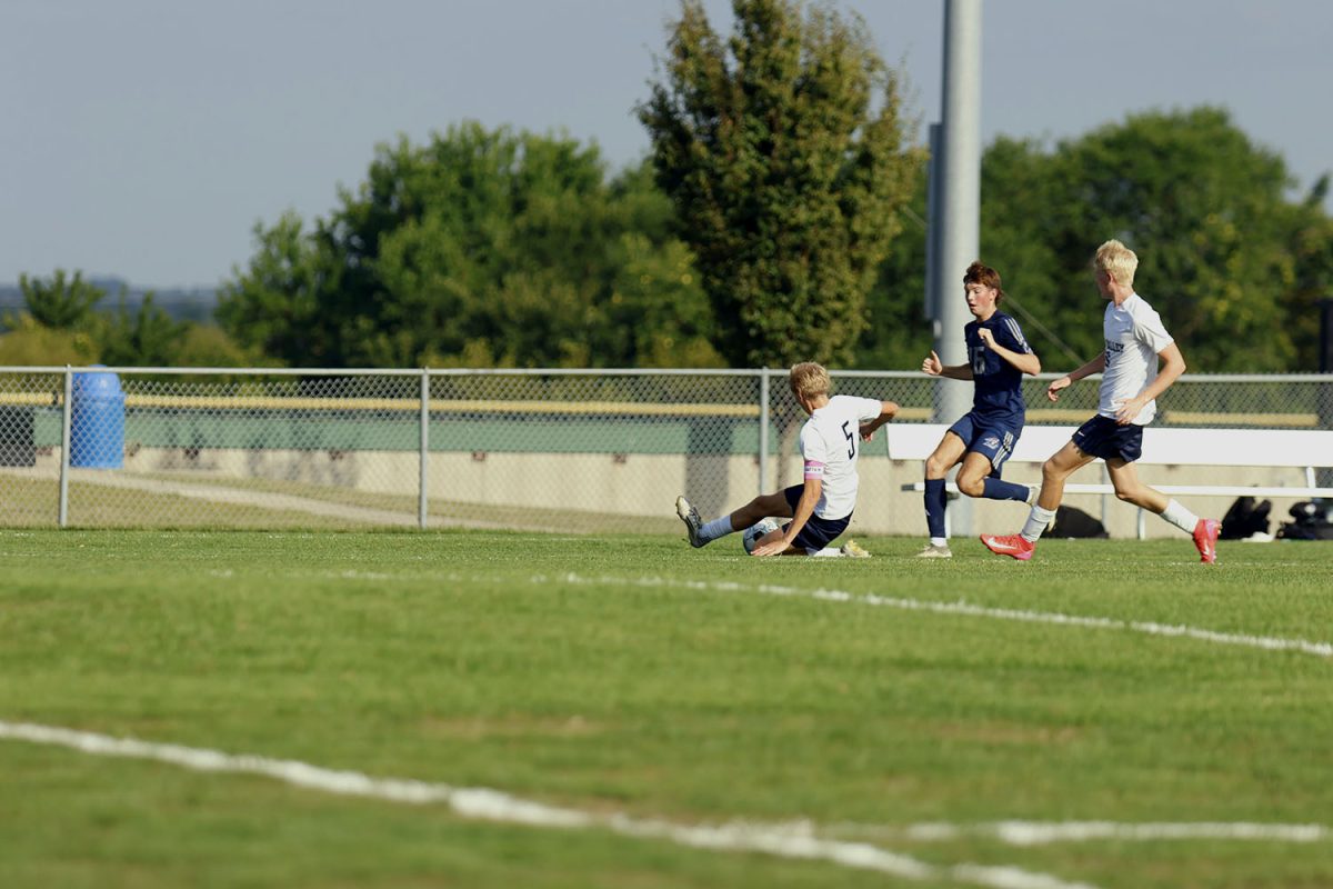 Senior Ayden Kostus stops a run by slide kicking the ball out of bounds to give the team time to regroup. Tuesday Sept. 2.