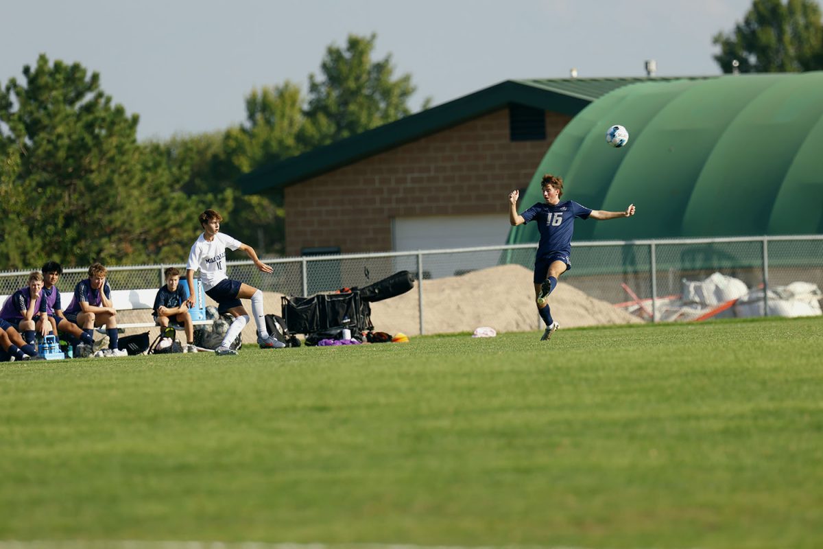 Senior Graham Kruger kicks the ball into the box in hopes of scoring. Tuesday Sept. 2.