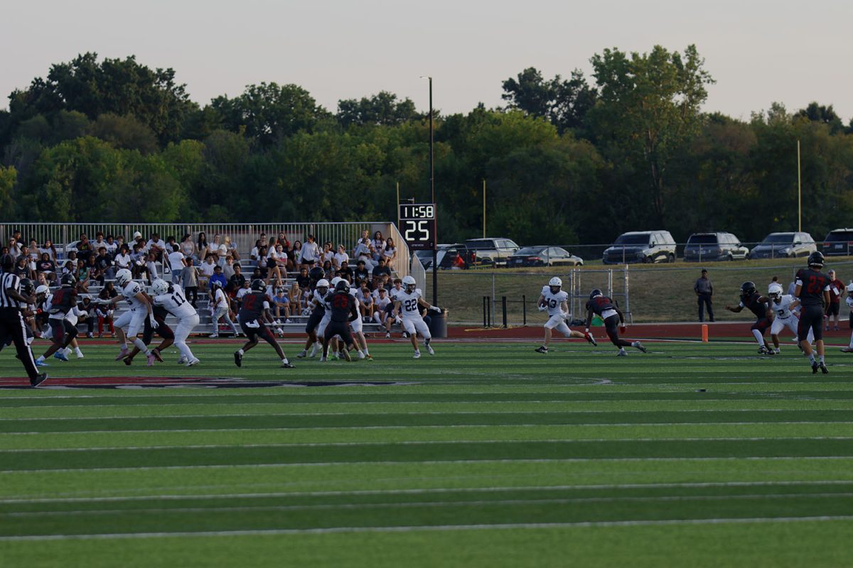 Wide receiver senior Bryce Shorten runs though Lee Summit's defense, getting good yards.
