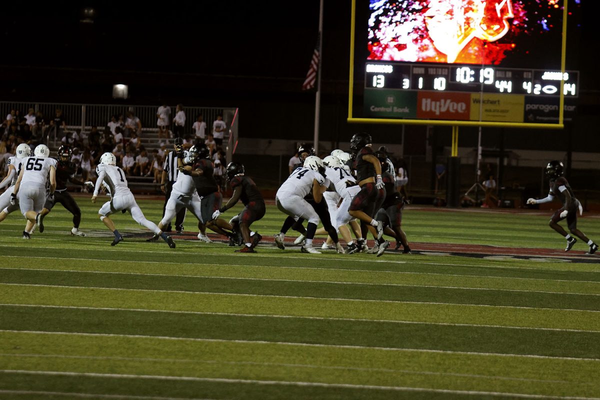 Quarterback Blake Jay runs out of the pocket hoping to get a first down.
