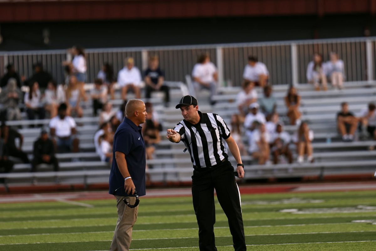 Coach Applebee argues with  the referee over a call he didn't agree with.
