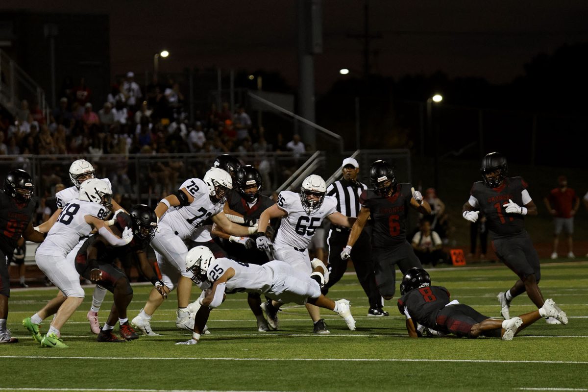 Senior Reggie Reece dives to try for a first down.