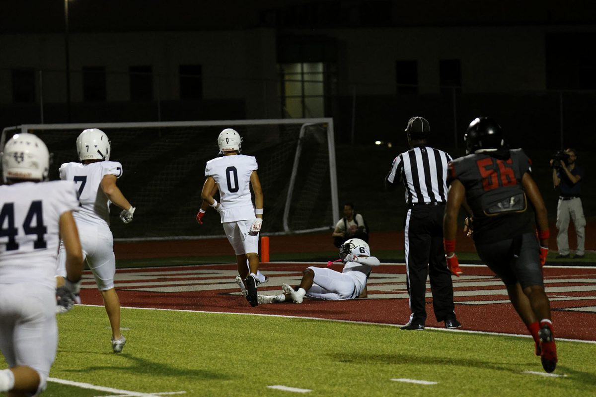 The football team attempts to stop a touchdown.