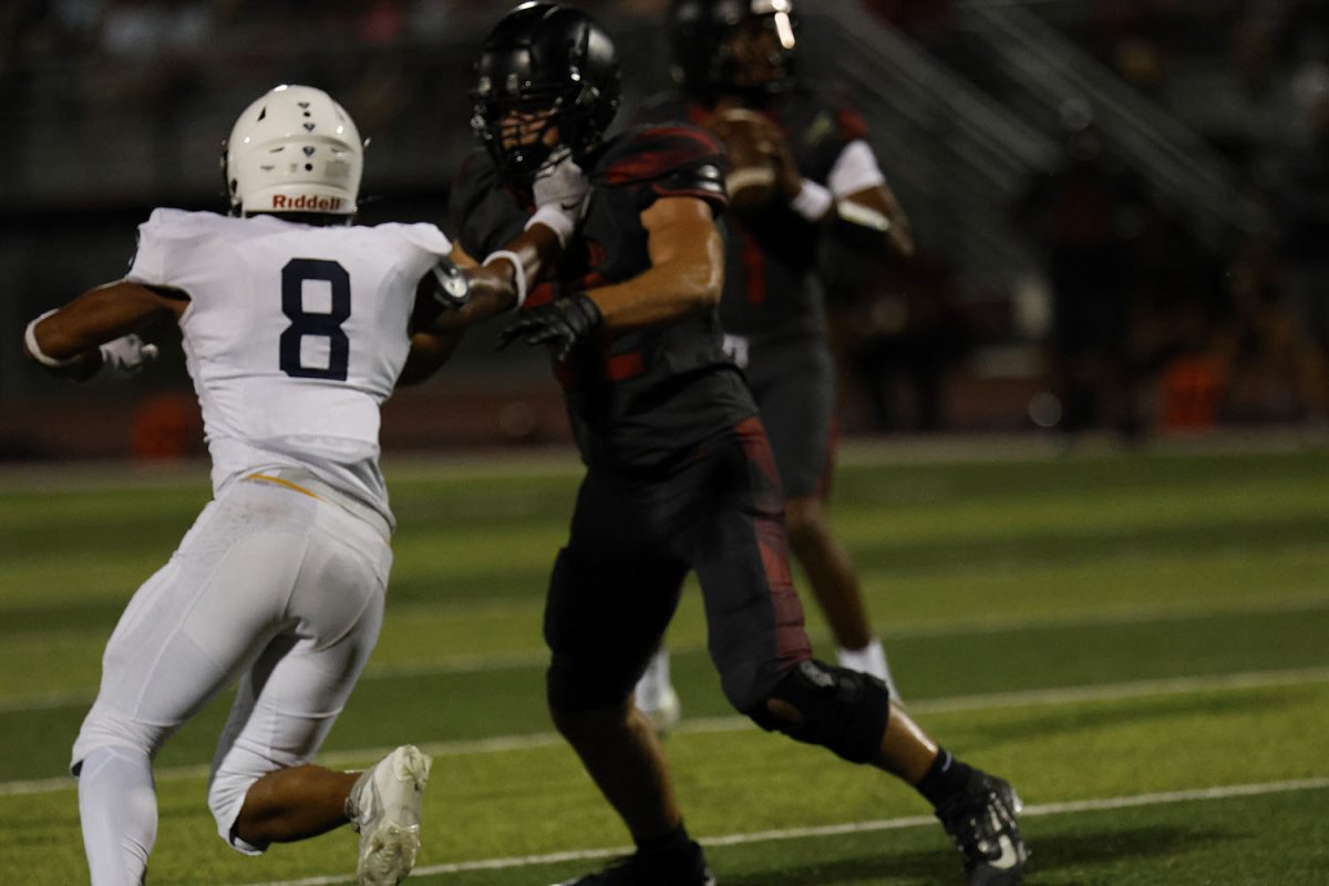 Junior Larry Jones tries to break through the Lee Summit offensive line.
